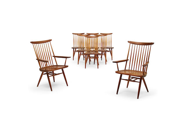 GEORGE NAKASHIMA (1905-1990) Set of Eight 'New' Dining Chairs1961comprising two armchairs and six side chairs, American black walnut with sap grain detail, each signed 'Golden' in black marker on undersideheight of armchairs 37 3/4in (96.2cm); width 24 3/4in (63cm); depth 21in (53cm); height of side chairs 36in (91.5cm); width 18 1/2in (47cm); depth 17 1/2in (44.5cm)