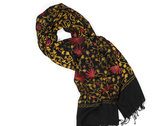 A RUTH BADER GINSBURG EMBROIDERED SHAWL. A black woolen shawl with fringed edges, 203 x 101 cm, embroidered in a red and gold floral pattern.