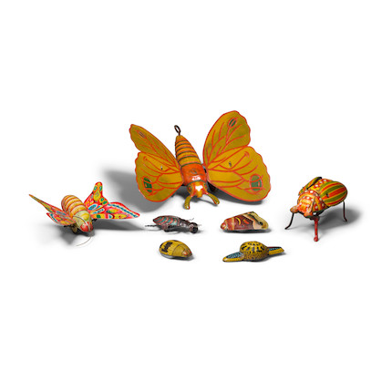 A GROUP OF SEVEN PAINTED METAL MECHANICAL INSECT TOYS early 20th century, one by Strauss Mechanical toys width of largest 7 1/2in (19cm) image 1