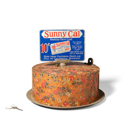A SUNNY CAL FROSTED FRUITCAKE VENDING MACHINE early 20th century, produced by R. O. Whyman & Co., with original paintheight 12in (30cm); diameter 15in (38cm) image 2