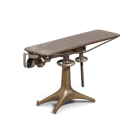 A CAST BRONZE AND STAINLESS STEEL MODEL OF A MORTICIAN'S TABLE early 20th centuryheight 7 1/2in (19.1cm); length 12 1/2in (31.7cm) image 1