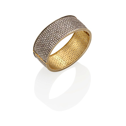 A SILVER-TOPPED GOLD AND DIAMOND HINGED BRACELET image 1