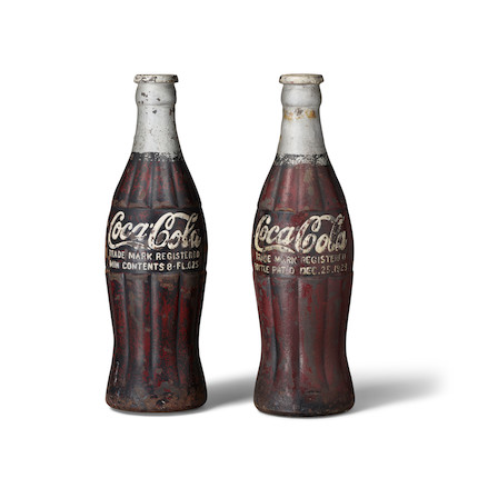 A RARE COMPANION PAIR OF PAINTED CAST IRON COCA-COLA BOTTLE SCULPTURES circa 1923height 20in (51cm) image 1