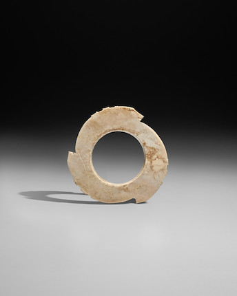 A JADE NOTCHED DISC, YABI Late Neolithic period - early Shang dynasty image 1