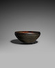 Thumbnail of A BURNISHED BLACK POTTERY ALMS BOWL, PATRA Tang dynasty image 1