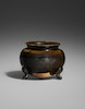 Thumbnail of A DARK-BROWN GLAZED STONEWARE TRIPOD CENSER Tang dynasty, 8th/9th century image 1