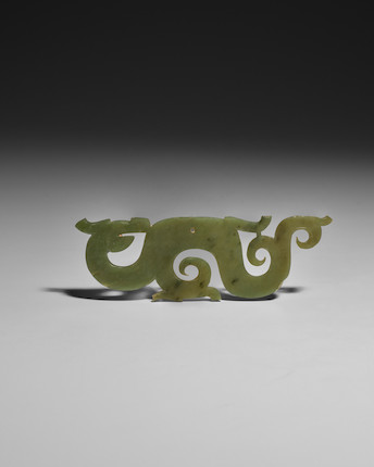 AN ARCHAIC GREEN JADE OPENWORK DRAGON-FORM PENDANT, HUANG Warring States period image 1