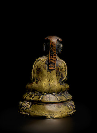 A COPPER AND SILVER INLAID BRASS FIGURE OF CHOKYI PALSANG TIBET, 15TH/16TH CENTURY image 3
