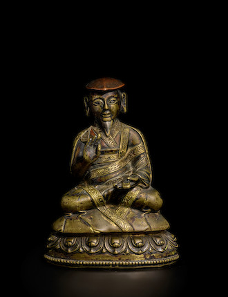 A COPPER AND SILVER INLAID BRASS FIGURE OF CHOKYI PALSANG TIBET, 15TH/16TH CENTURY image 2