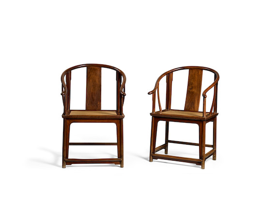 A PAIR OF HUANGHUALI HORSESHOE BACK ARMCHAIRS, QUANYI 17th/18th century (2) image 1