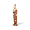 Thumbnail of AN UNUSUAL PAINTED POTTERY FIGURE OF AN ATTENDANT  Tang dynasty image 1