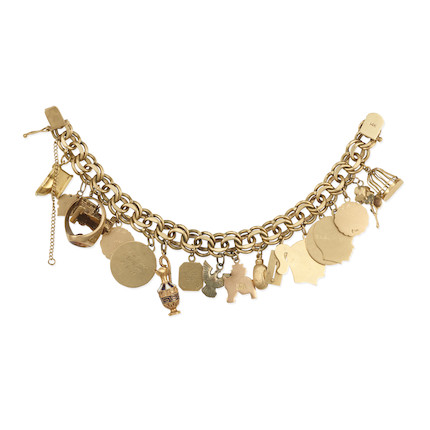 A GOLD AND SILVER CHARM BRACELET image 2