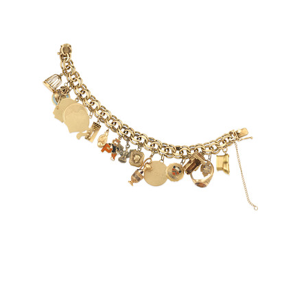 A GOLD AND SILVER CHARM BRACELET image 1