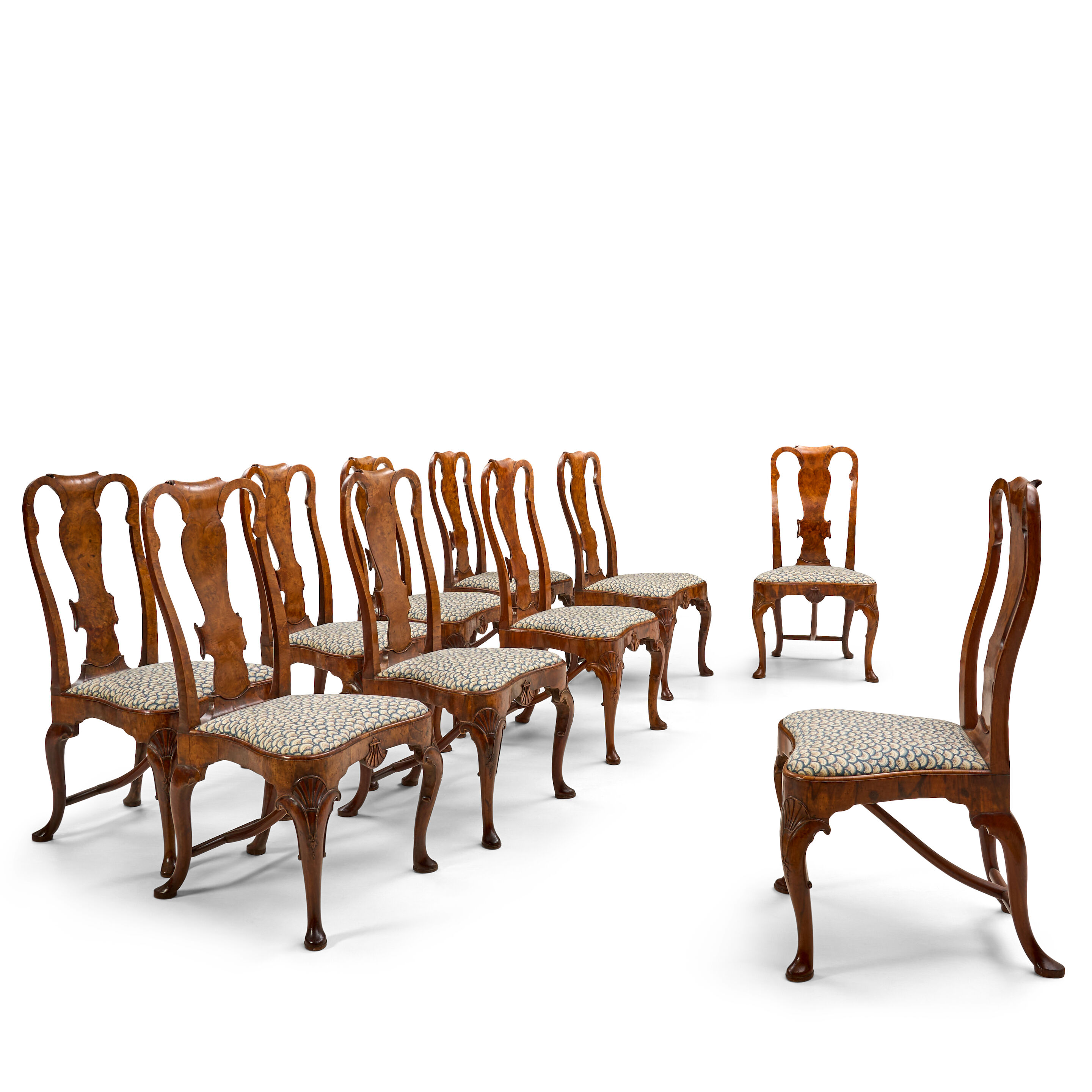 A Fine Set of Ten Queen Anne Walnut Side Chairs, England, early 18th century,